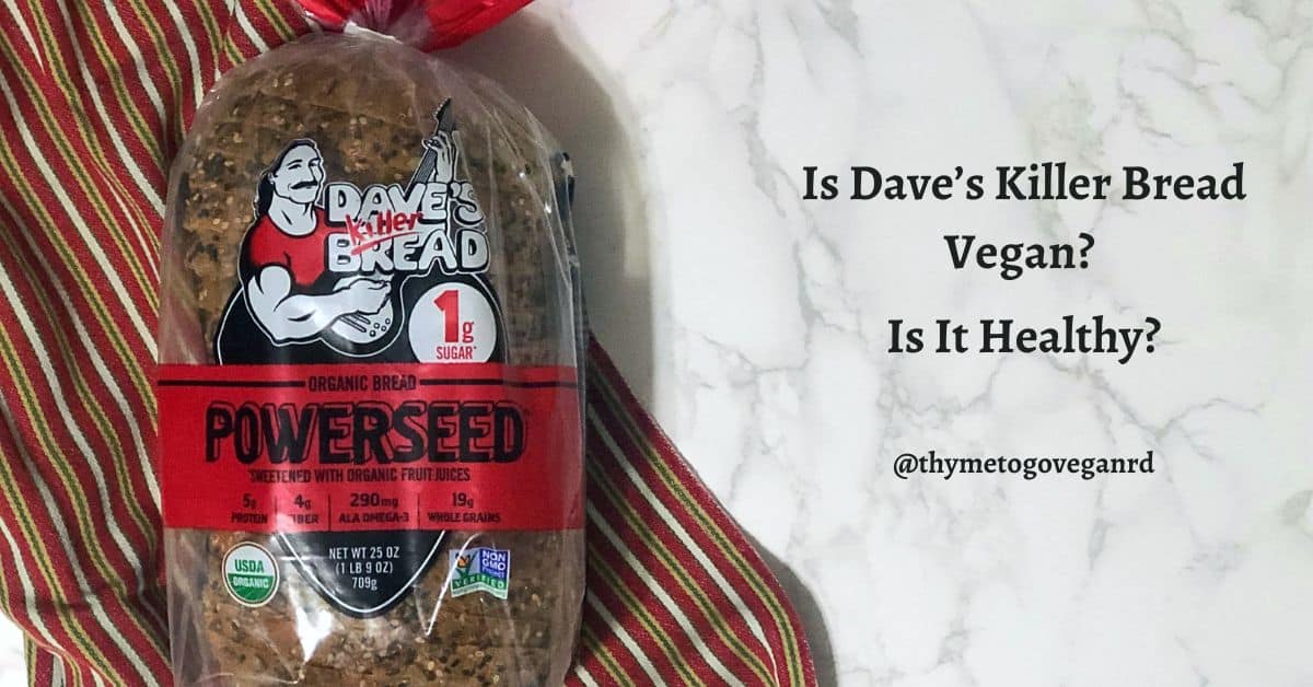 Photo of a loaf of Dave's Killer Bread with a red striped kitchen towel on a marble countertop with text overlay reading "Is dave's killer bread vegan? Is it healthy?"