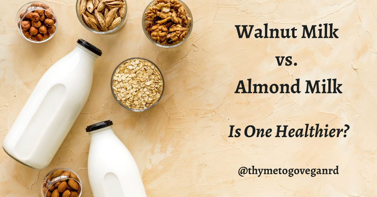 Bottles of almond and walnut milk on a pink granite countertop with text overlay reading "walnut milk vs. almond milk: is one healthier? @thymetogoveganrd"